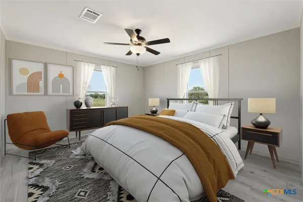 a bedroom with a bed and furniture