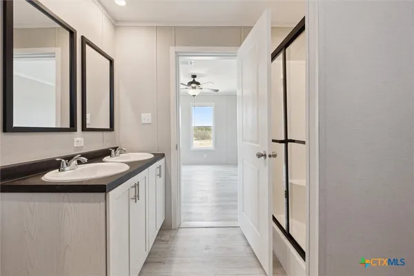 a bathroom with a sink and a mirror