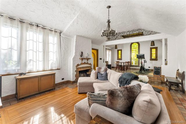 a dining room with furniture window and wooden floor