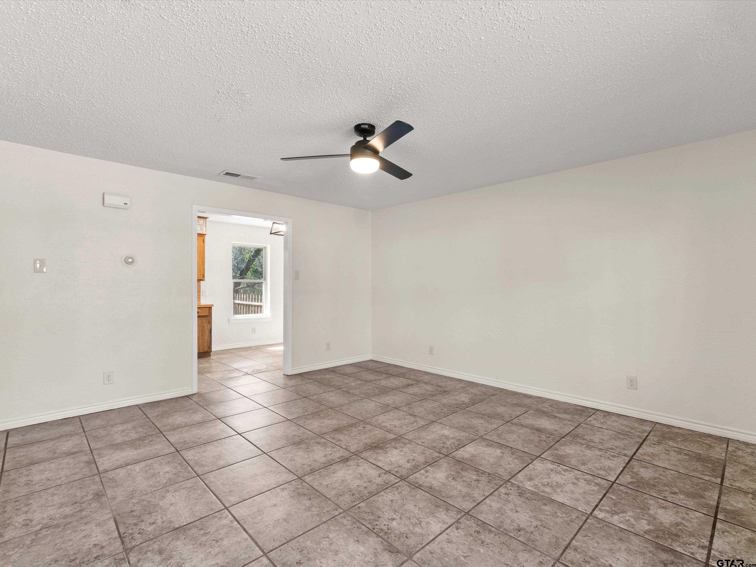 901 Skyview Drive Gilmer, TX 75644 - Photo 11 of 18 wooden floor in an empty room
