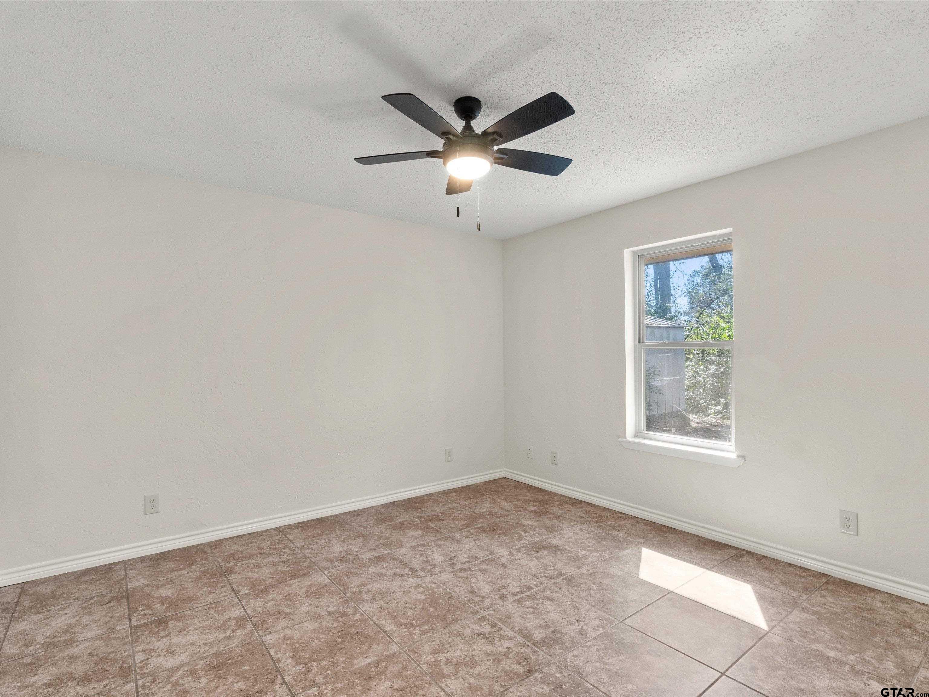 901 Skyview Drive Gilmer, TX 75644 - Photo 13 of 18 a view of an empty room with a window