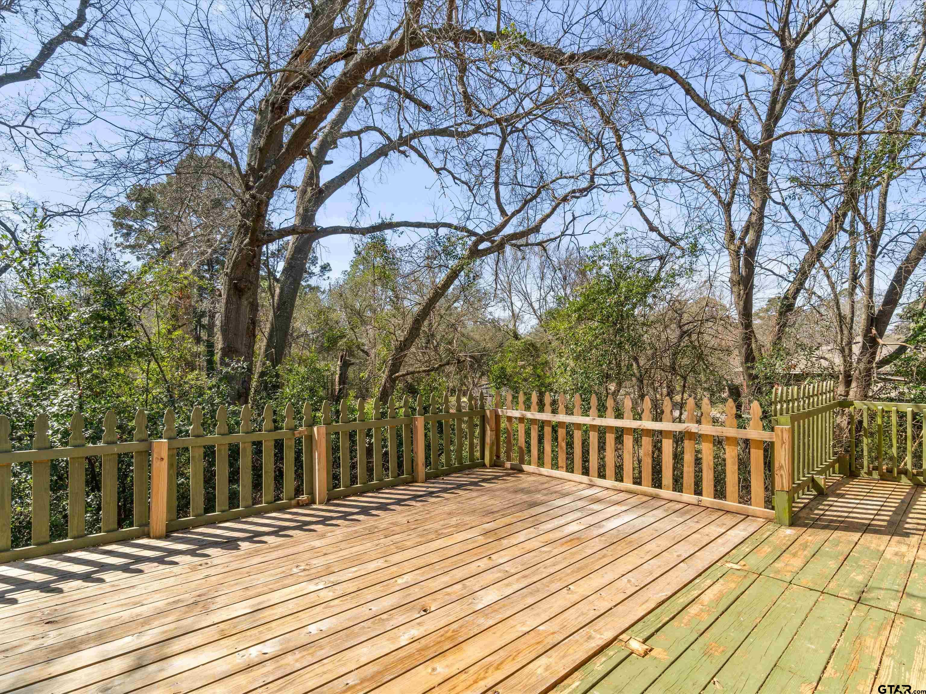 901 Skyview Drive Gilmer, TX 75644 - Photo 15 of 18 a view of a house with a wooden fence