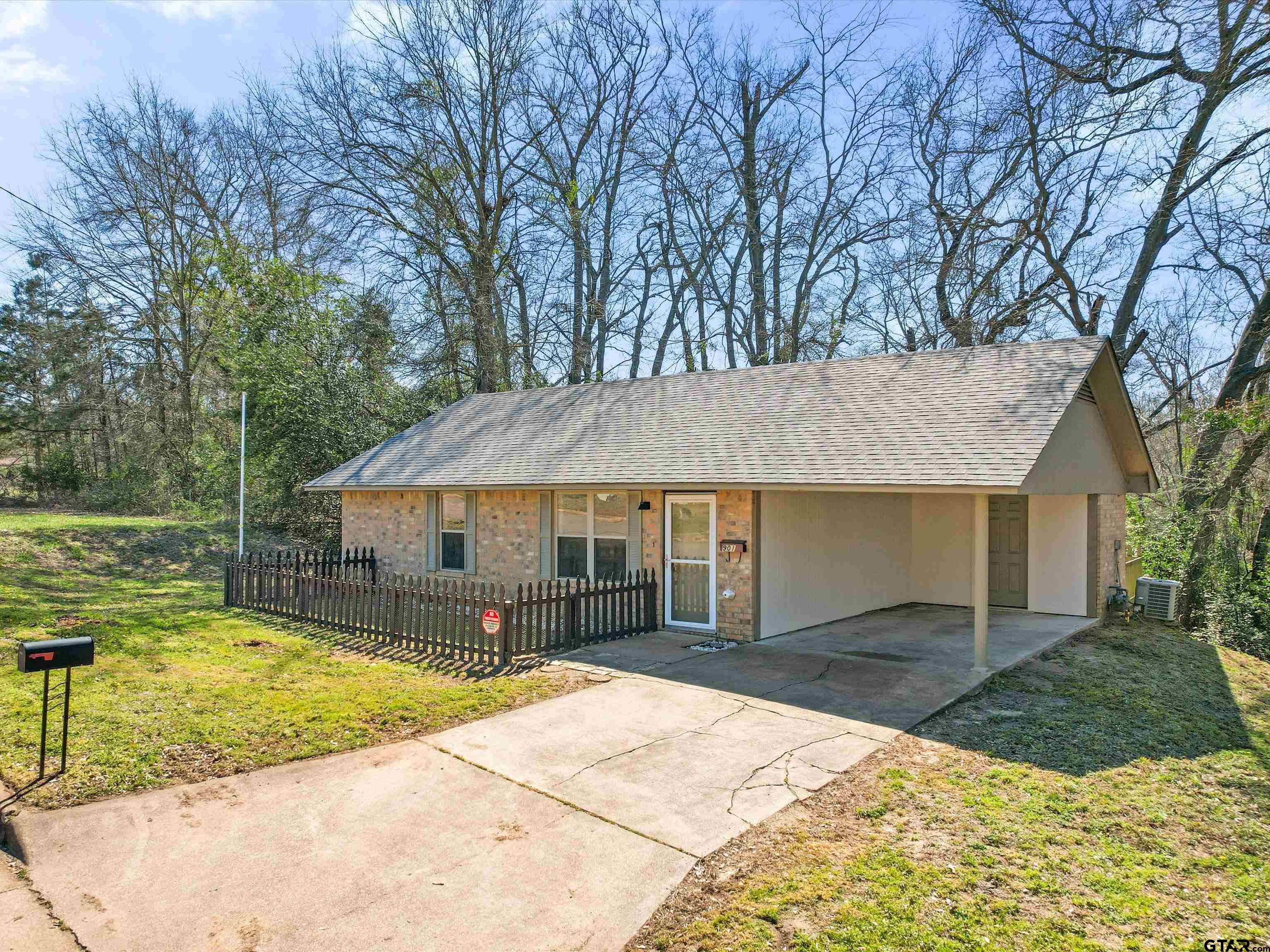 901 Skyview Drive Gilmer, TX 75644 - Photo 2 of 18 a house view with a swimming pool