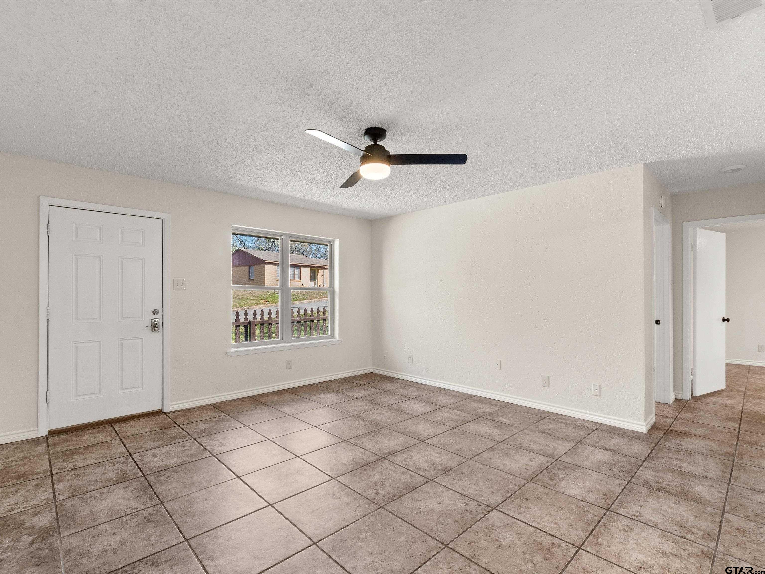 901 Skyview Drive Gilmer, TX 75644 - Photo 7 of 18 a view of an empty room with a window