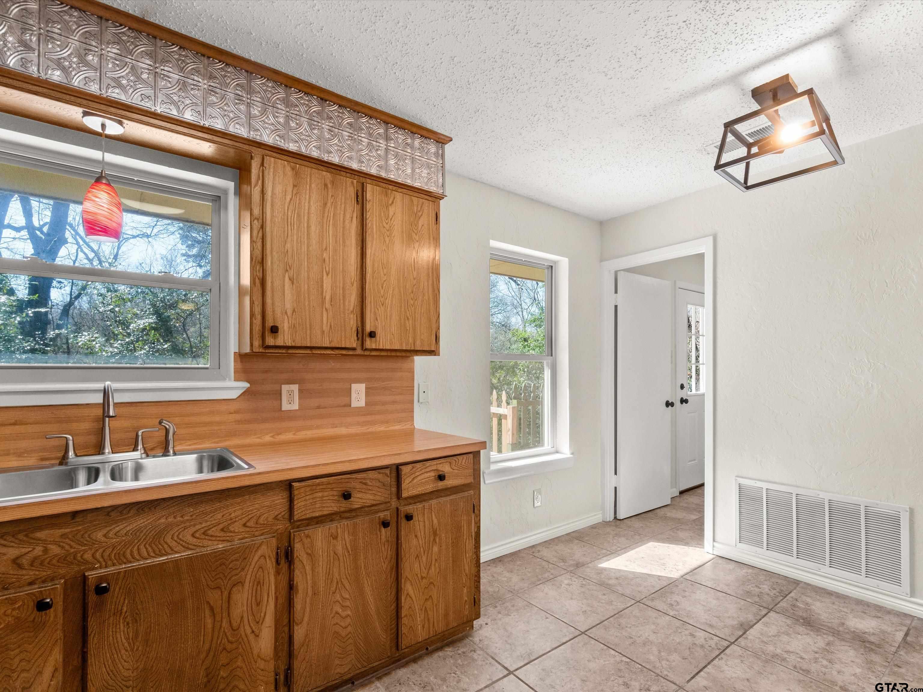 901 Skyview Drive Gilmer, TX 75644 - Photo 10 of 18 a kitchen with a sink and a window
