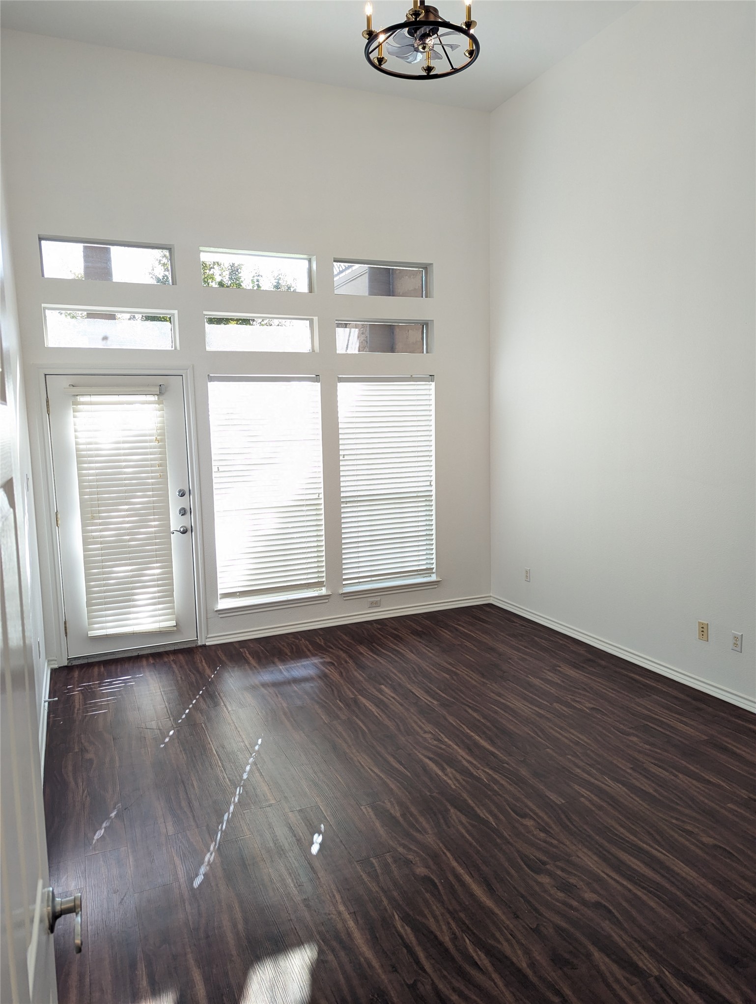 2918 Ranch Road 620 North, Unit Y194 Austin, TX 78734 - Photo 14 of 35 a view of an empty room with wooden floor and a window