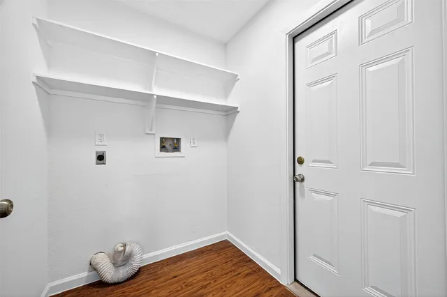 a bathroom with a bathtub toilet and window