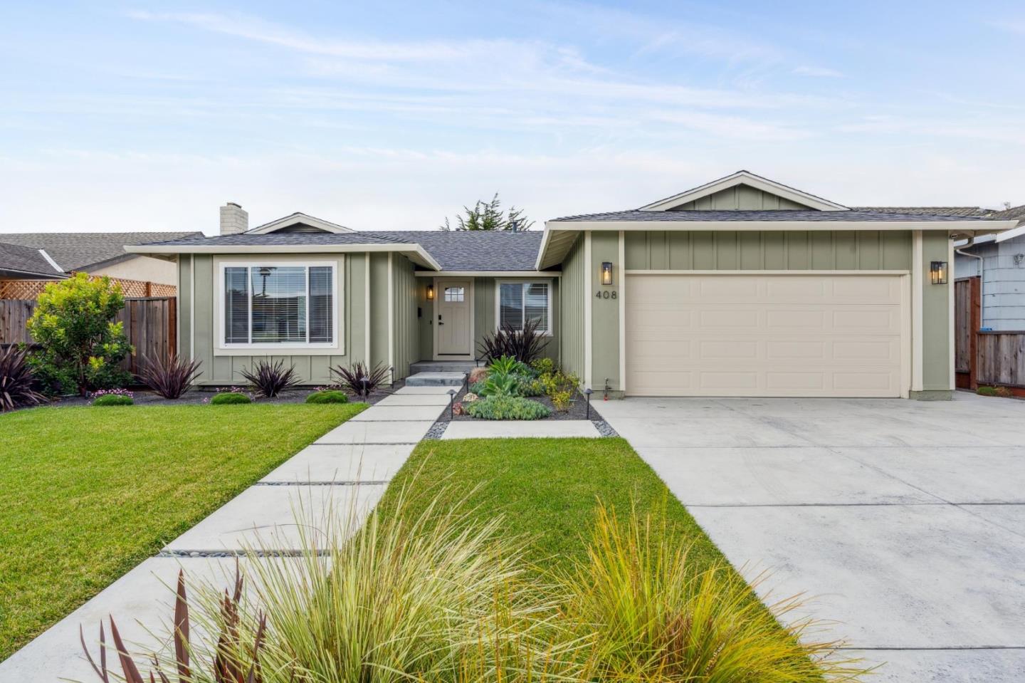 a front view of a house with garden