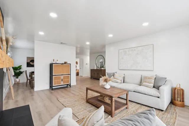 a living room with furniture and a table