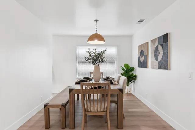 a dining room with furniture and window