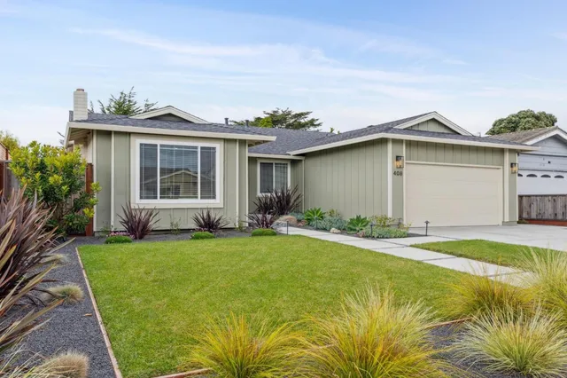 a front view of a house with a yard