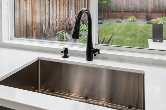 a close view of a sink and a yard