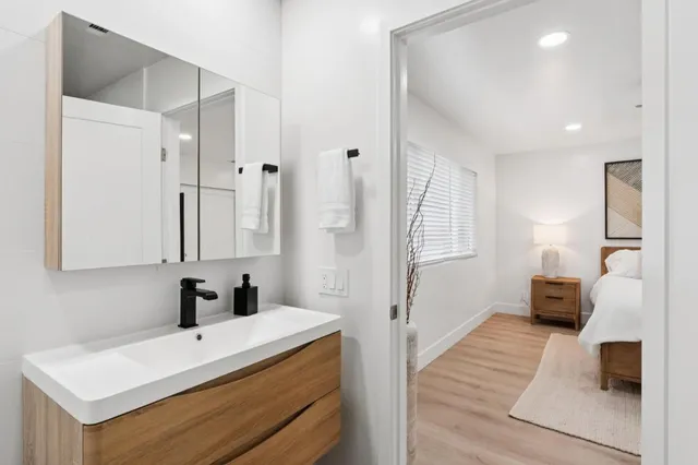 a bathroom with a glass shower door