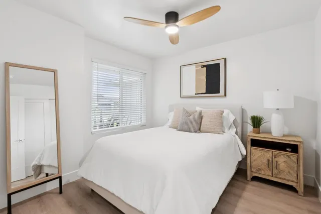 a bedroom with a bed and a window