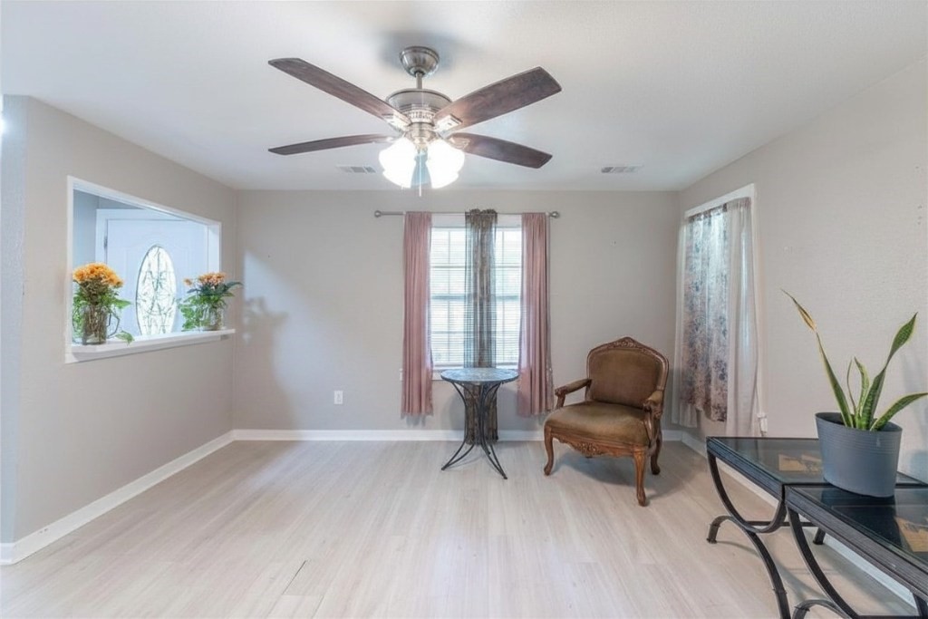 2118 Rolling Hills Road Conroe, TX 77303 - Photo 11 of 39 Flexible sitting area near the entrance offers endless possibilities as a reading nook, home office, or conversation space.