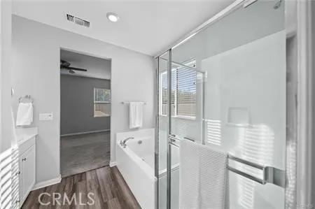 a bathroom with a bathtub and a shower