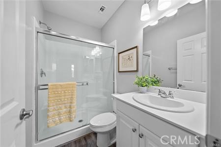 20565 Lost Creek Road Riverside, CA 92507 - Photo 17 of 32 a bathroom with a sink toilet double vanity and shower