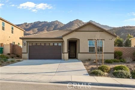 20565 Lost Creek Road Riverside, CA 92507 - Photo 2 of 32 a front view of a house with a garden