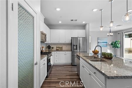 20565 Lost Creek Road Riverside, CA 92507 - Photo 4 of 32 a kitchen with refrigerator and cabinets