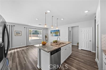 20565 Lost Creek Road Riverside, CA 92507 - Photo 5 of 32 a kitchen that has a kitchen island wooden floor and a window