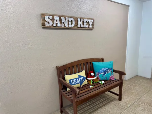 a bench sitting on top of a wooden floor
