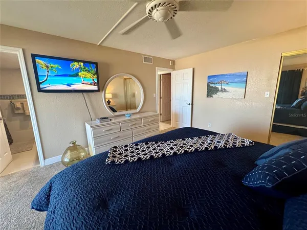 a bedroom with a bed and a table in it