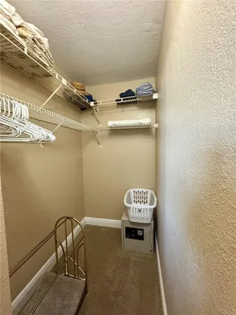 a bedroom with a bed and furniture