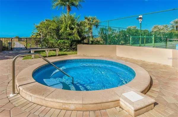 a view of a swimming pool with a patio