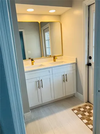 a bathroom with a sink and a mirror