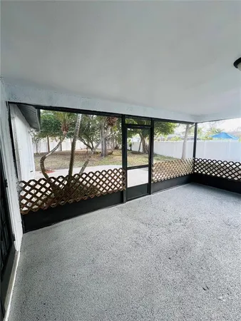 a view of dirt yard with a tree