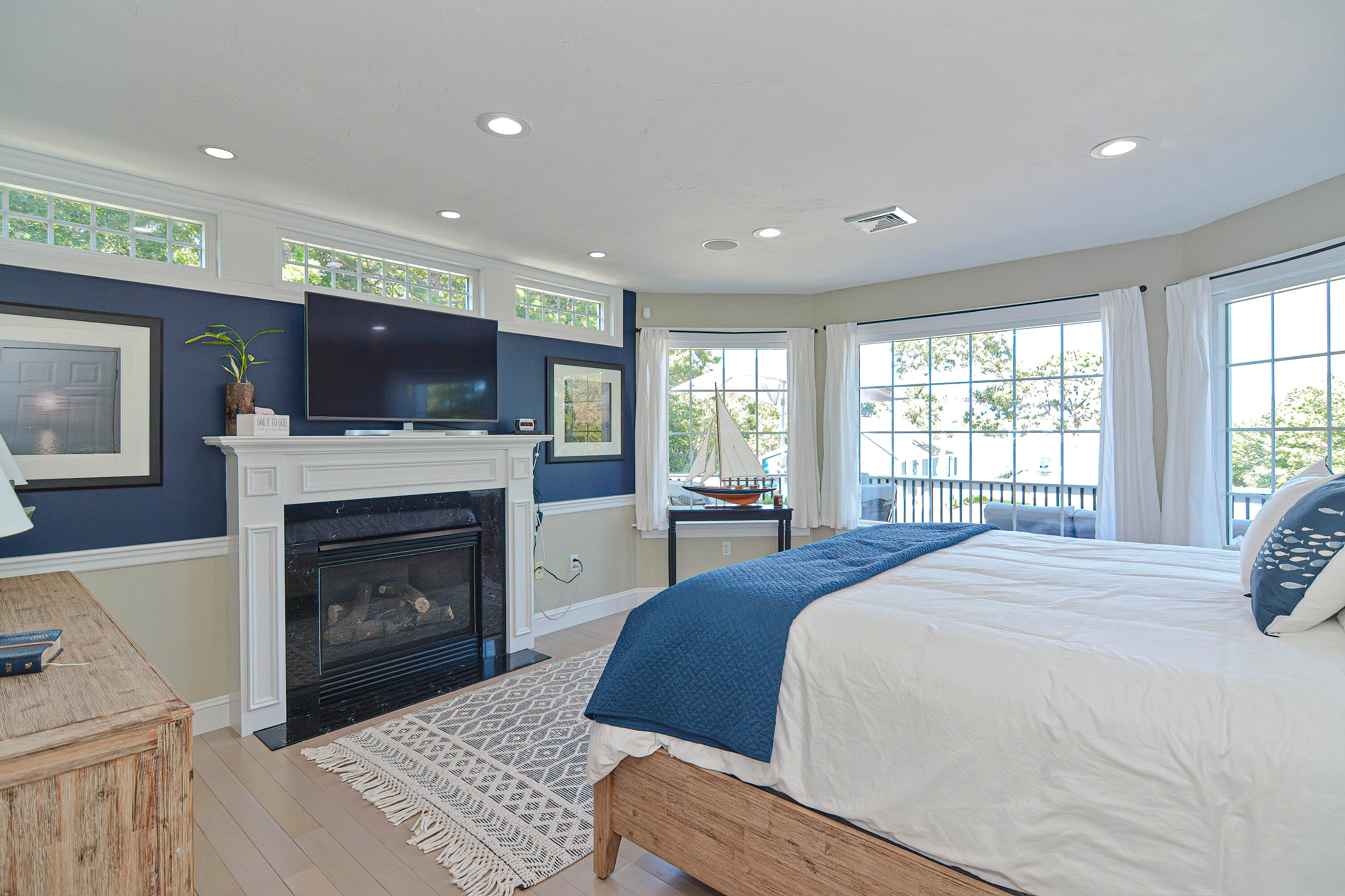 12-13 Shell Lane Wareham, MA 02571 - Photo 19 of 52 a spacious bedroom with a bed and a fireplace