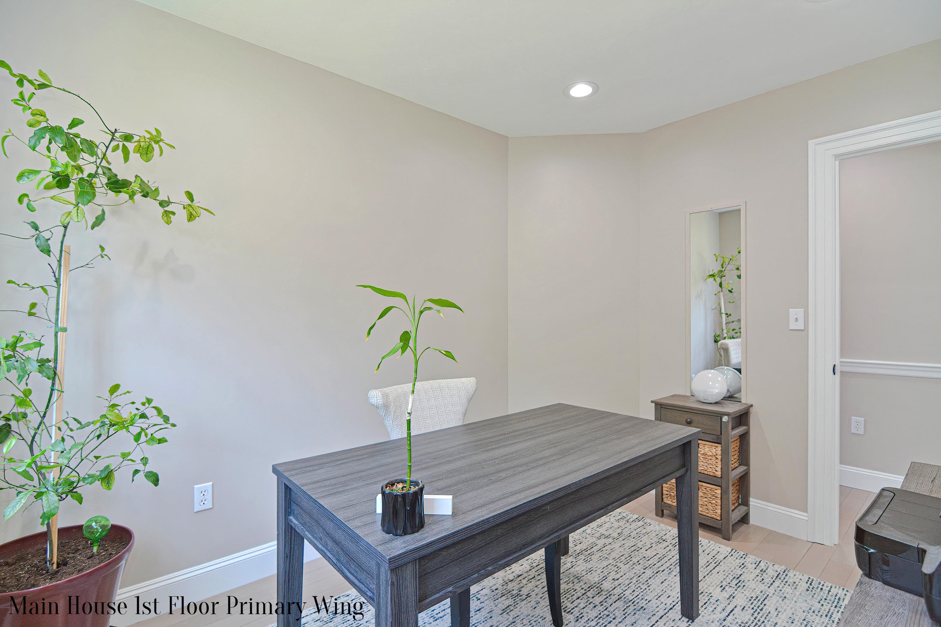 12-13 Shell Lane Wareham, MA 02571 - Photo 24 of 52 a table with a vase and flowers on it