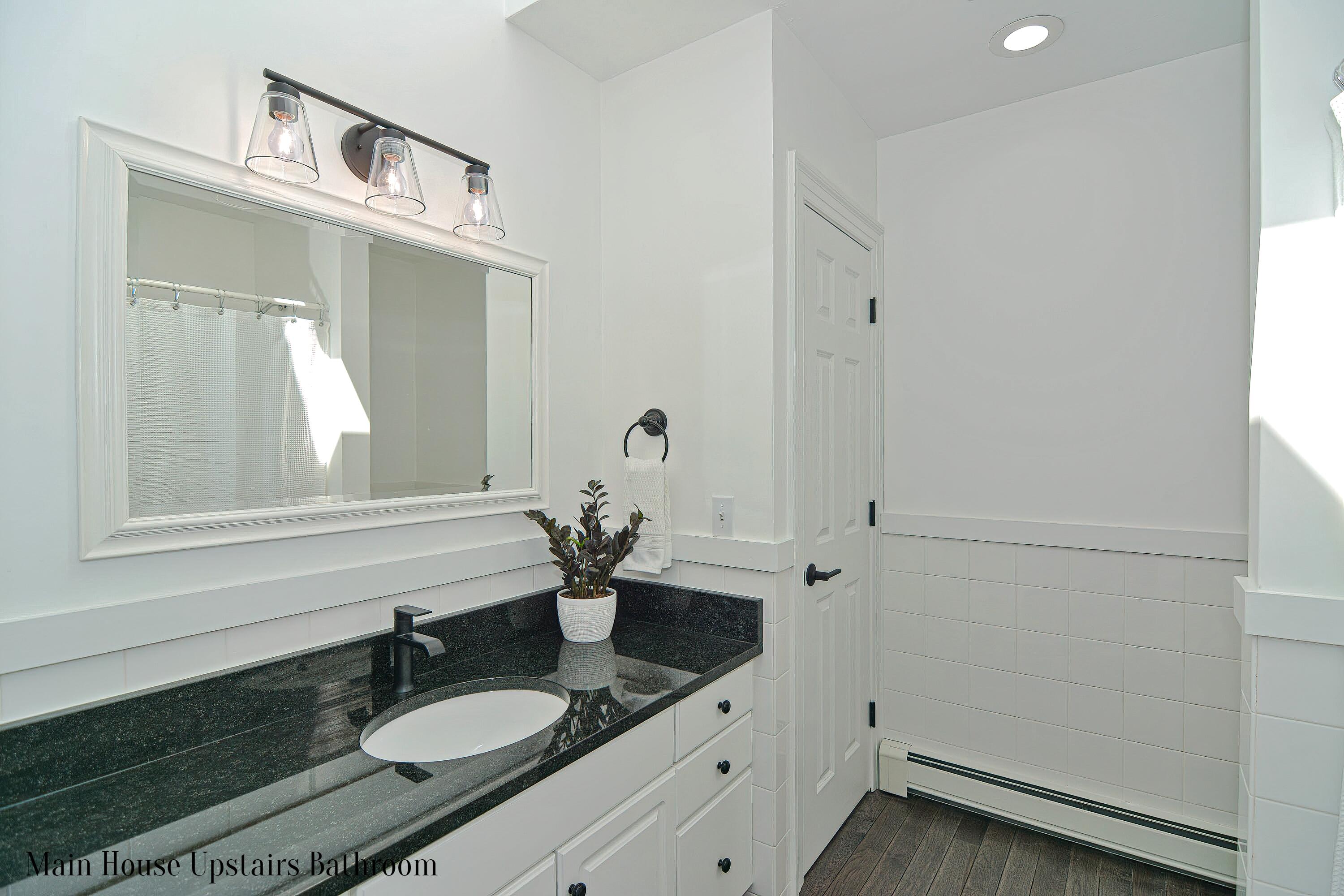 12-13 Shell Lane Wareham, MA 02571 - Photo 29 of 52 a bathroom with a sink vanity granite and a mirror