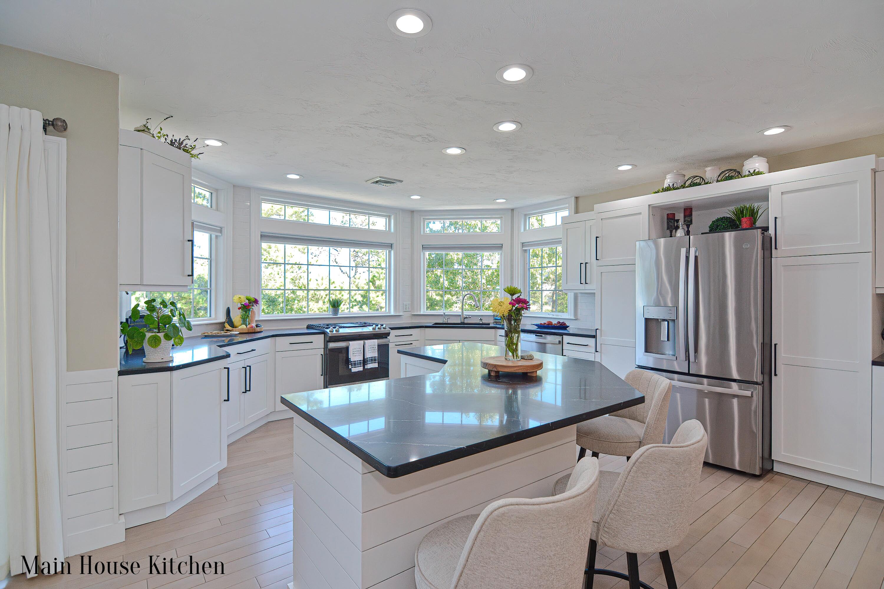 12-13 Shell Lane Wareham, MA 02571 - Photo 10 of 52 a kitchen with stainless steel appliances granite countertop sink refrigerator dining table and chairs