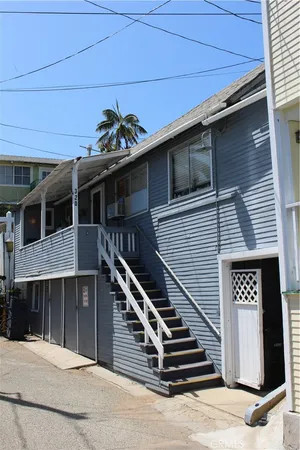 a front view of a house with stairs