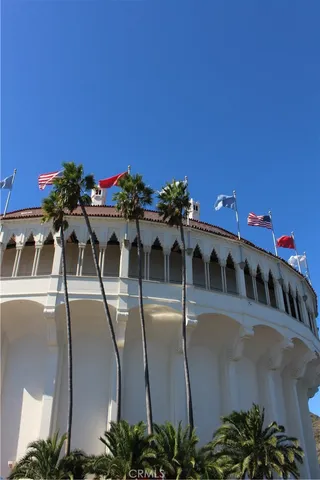a view of a dining room with furniture and a potted plant