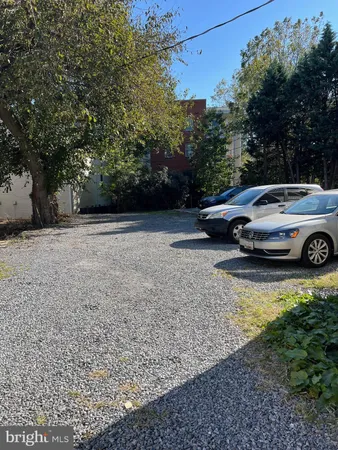 a view of street with parked cars