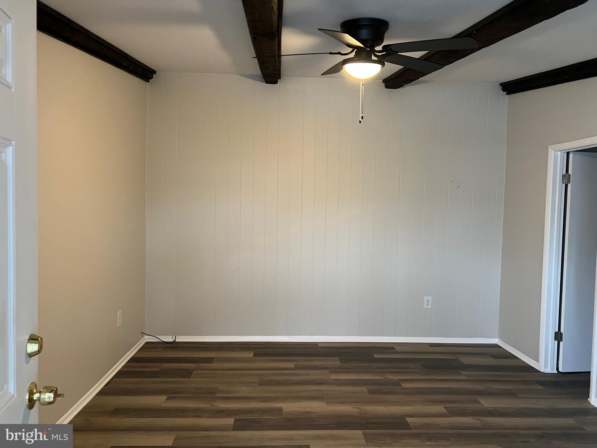 360 West Patrick Street, Unit 4 Frederick, MD 21701 - Photo 5 of 9 a view of an empty room with wooden floor