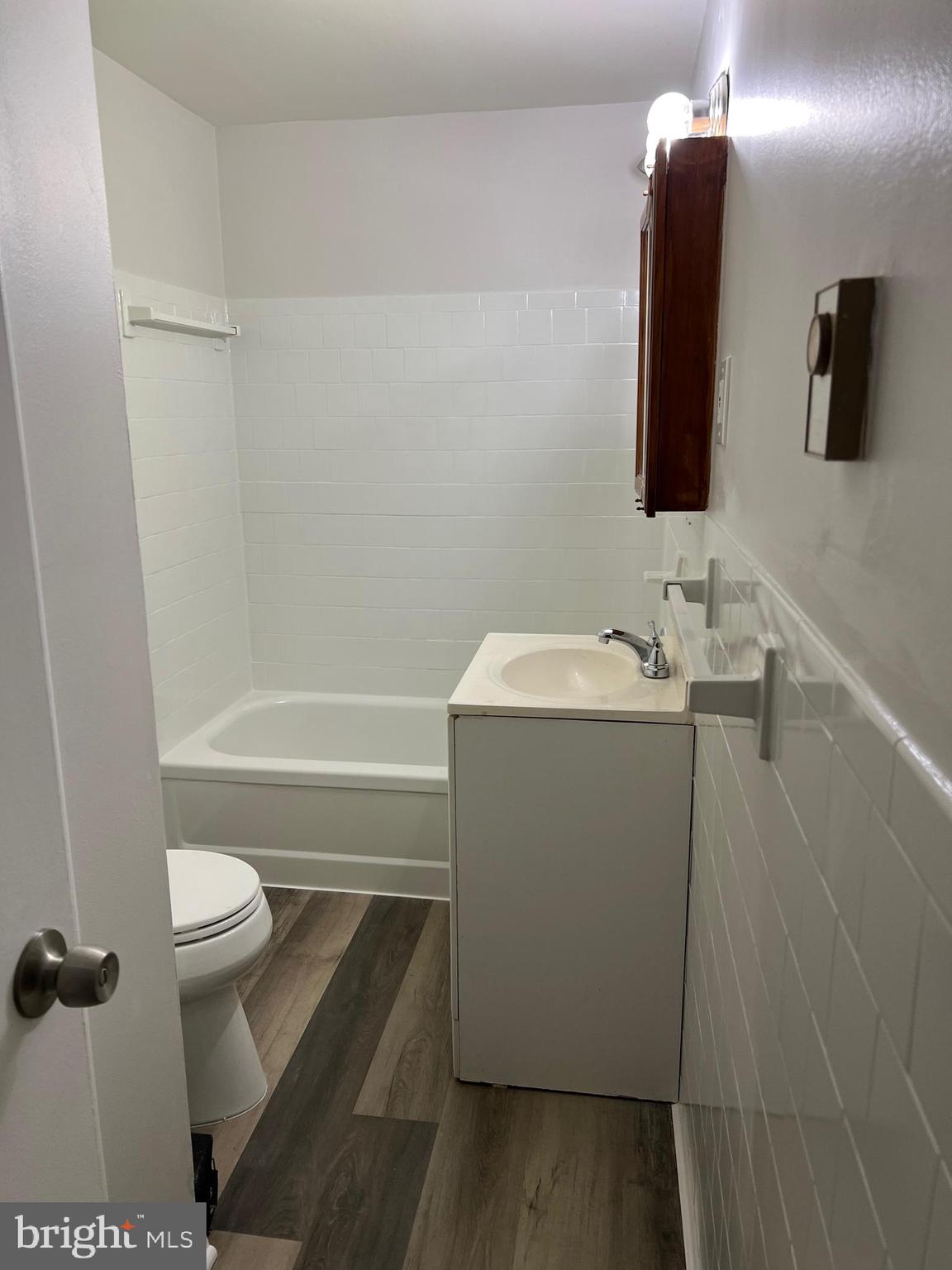 360 West Patrick Street, Unit 4 Frederick, MD 21701 - Photo 8 of 9 a bathroom with a sink a toilet and shower