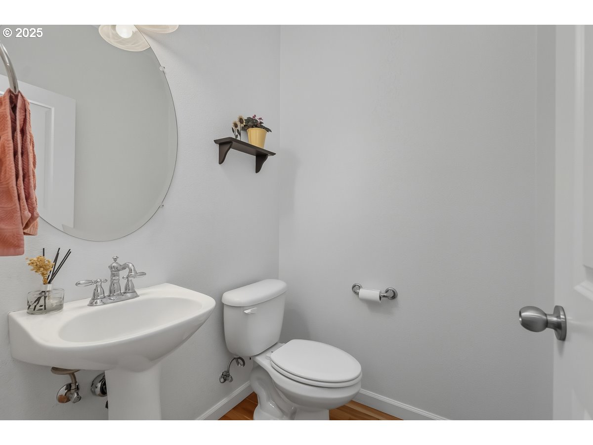 8810 Southeast 12th Avenue Portland, OR 97202 - Photo 11 of 47 a bathroom with a sink mirror and toilet