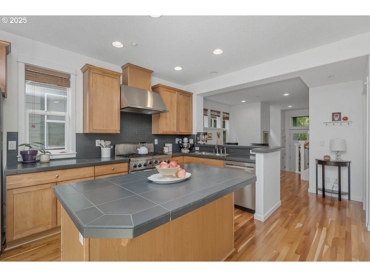 8810 Southeast 12th Avenue Portland, OR 97202 - Photo 20 of 47 a kitchen with a sink appliances and cabinets