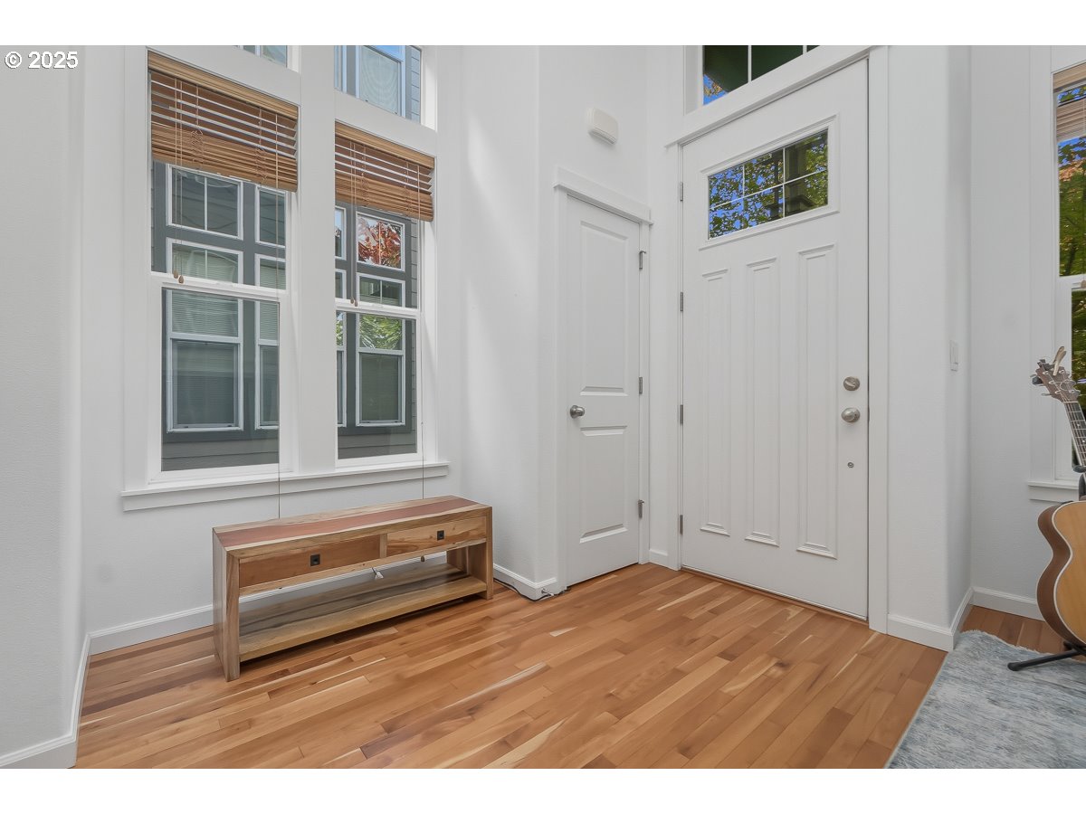 8810 Southeast 12th Avenue Portland, OR 97202 - Photo 3 of 47 a view of wooden floor and windows in a room