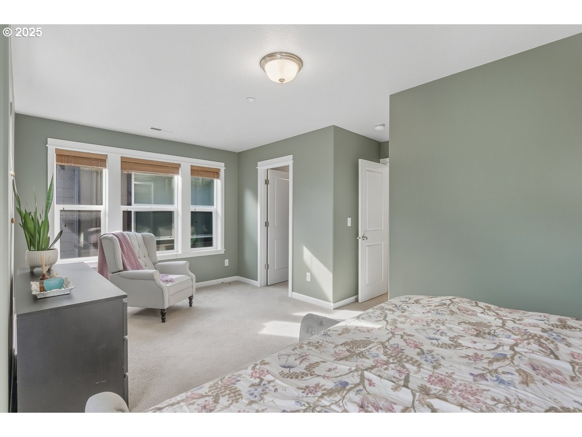 8810 Southeast 12th Avenue Portland, OR 97202 - Photo 31 of 47 a living room with furniture window and floor to ceiling windows