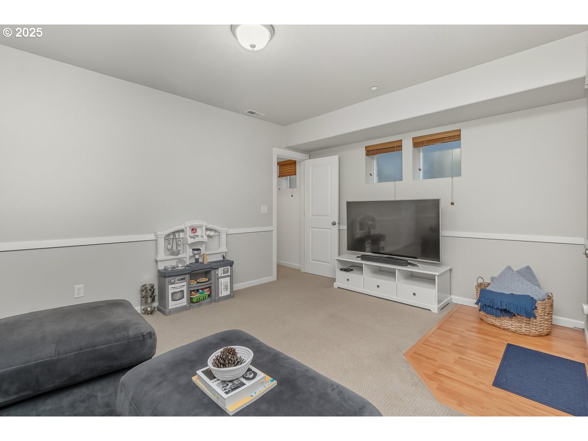 8810 Southeast 12th Avenue Portland, OR 97202 - Photo 39 of 47 a living room with furniture and a flat screen tv