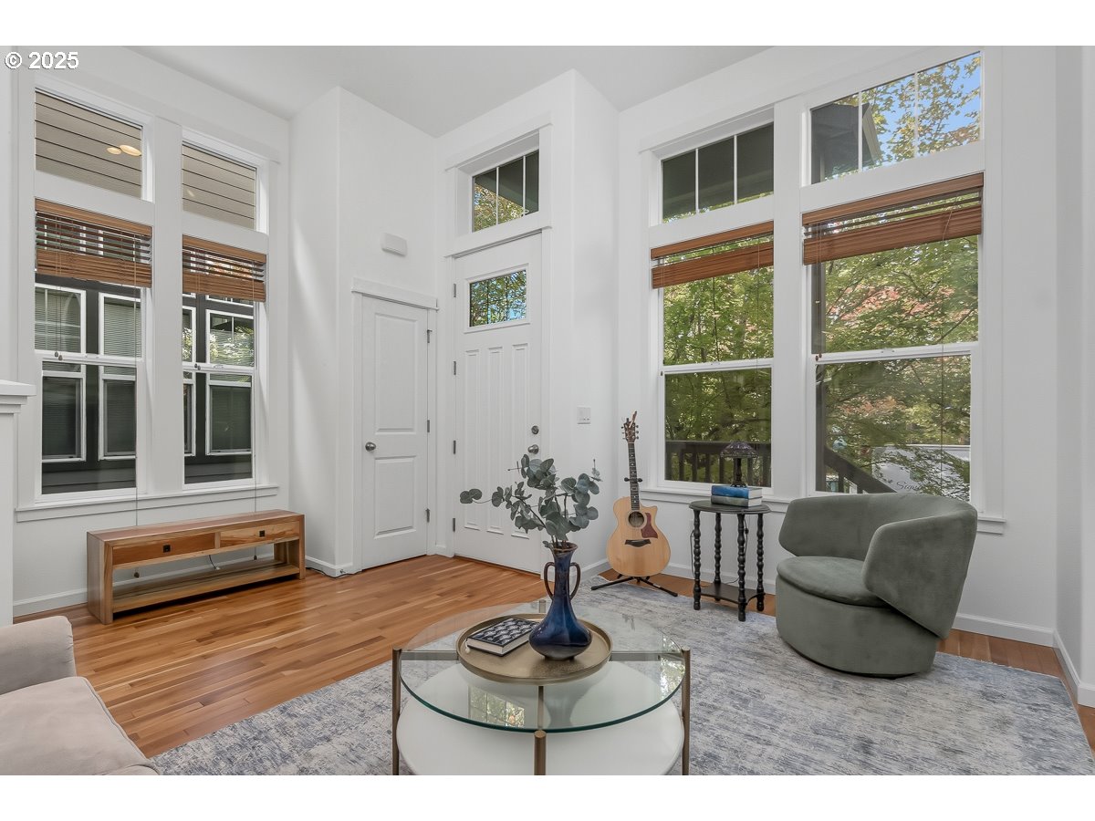 8810 Southeast 12th Avenue Portland, OR 97202 - Photo 7 of 47 a living room with furniture and a floor to ceiling window