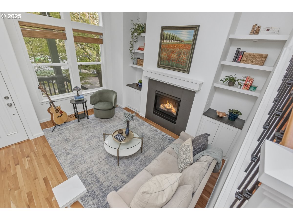 8810 Southeast 12th Avenue Portland, OR 97202 - Photo 8 of 47 a living room with furniture and a fireplace