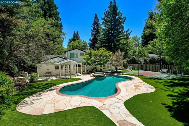 a view of a house with a yard porch and sitting area