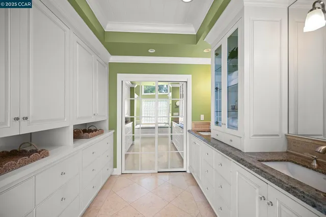 a view of a kitchen with a sink and dishwasher next to a window