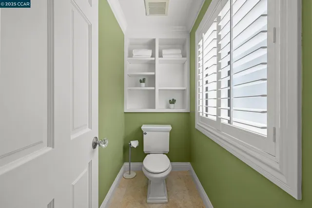 a bathroom with a toilet and a sink