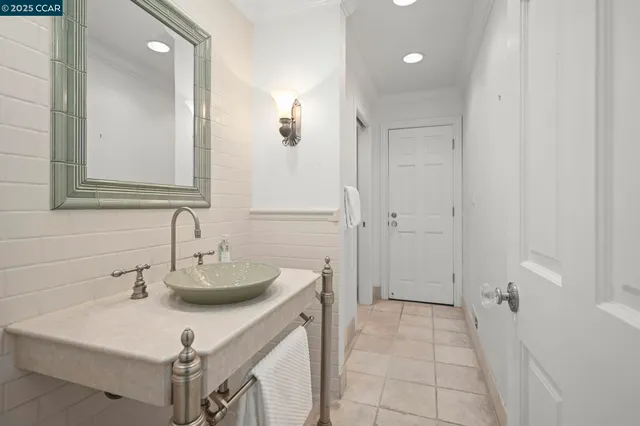 a bathroom with a sink a mirror and a shower